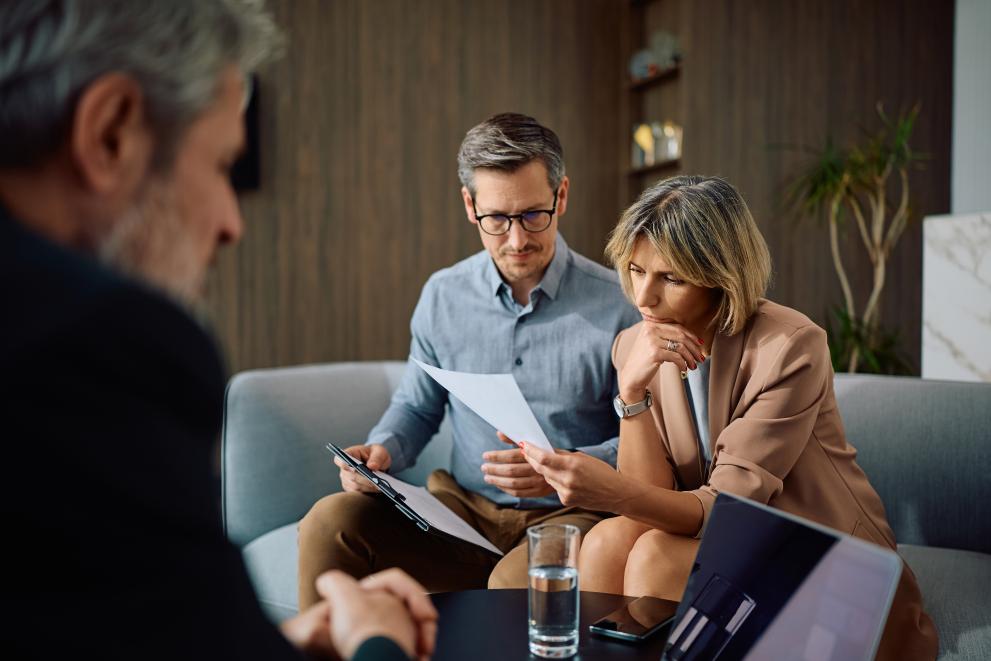 Adult couple in a meeting with their financial advisor